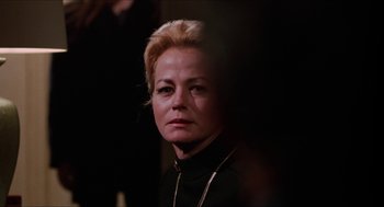 Movie still from “Joe” (1970), directed by John G. Avildsen – A person wearing a black shirt; Close Up shot, Over the shoulder angle