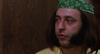Movie still from “Joe” (1970), directed by John G. Avildsen – A person wearing a hat; Close Up shot, Low angle