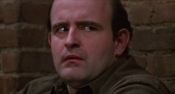 Movie still from “Joe” (1970), directed by John G. Avildsen – A person looking at the camera; Close Up shot, Low angle