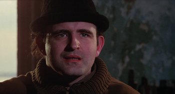 Movie still from “Joe” (1970), directed by John G. Avildsen – A person wearing a hat and a jacket; Close Up shot, Low angle