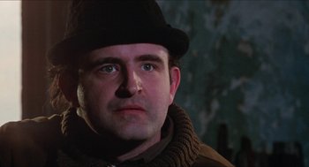 Movie still from “Joe” (1970), directed by John G. Avildsen – A person wearing a hat; Close Up shot, Low angle