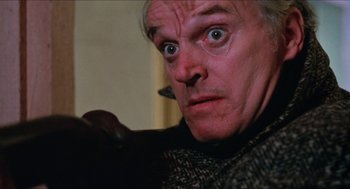 Movie still from “Joe” (1970), directed by John G. Avildsen – An older man with a surprised look on his face; Close Up shot, Low angle