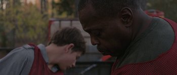 Movie still from “Joe” (2013), directed by David Gordon Green – A man and a boy looking down at each other; Close Up shot, Over the shoulder angle