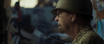 Movie still from “Joe” (2013), directed by David Gordon Green – An older man wearing a hat and glasses; Close Up shot, Over the shoulder angle