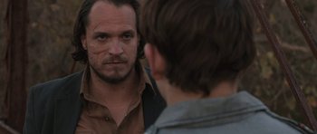 Movie still from “Joe” (2013), directed by David Gordon Green – A man looking at himself in the mirror; Close Up shot, Over the shoulder angle