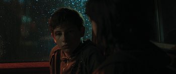 Movie still from “Joe” (2013), directed by David Gordon Green – A boy and a girl looking at each other in the dark; Close Up shot, Over the shoulder angle