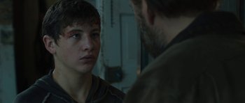 Movie still from “Joe” (2013), directed by David Gordon Green – A young man and older man in a room; Close Up shot, Over the shoulder angle