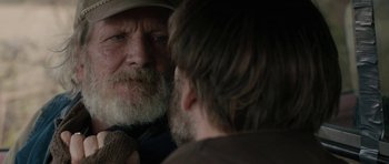 Movie still from “Joe” (2013), directed by David Gordon Green – An old man with a beard looking in the mirror; Close Up shot, Over the shoulder angle