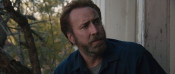 Movie still from “Joe” (2013), directed by David Gordon Green – A person with a beard; Close Up shot, Over the shoulder angle