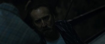 Movie still from “Joe” (2013), directed by David Gordon Green – A person with a beard; Close Up shot, Over the shoulder angle