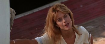 Movie still from “Joe Versus the Volcano” (1990), directed by John Patrick Shanley – A person with long hair; Close Up shot, Low angle
