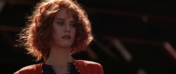 Movie still from “Joe Versus the Volcano” (1990), directed by John Patrick Shanley – A person wearing a red jacket; Close Up shot, Low angle