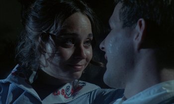 Movie still from “Johnny Got His Gun” (1971), directed by Dalton Trumbo – A man and a woman looking at one another; Close Up shot, Over the shoulder angle