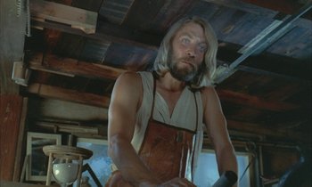 Movie still from “Johnny Got His Gun” (1971), directed by Dalton Trumbo – A man with long blond hair wearing an apron; Medium shot, Low angle