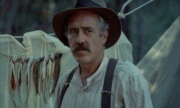 Movie still from “Johnny Got His Gun” (1971), directed by Dalton Trumbo – An older man wearing a hat and suspenders; Close Up shot, Low angle