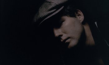 Movie still from “Johnny Got His Gun” (1971), directed by Dalton Trumbo – A man wearing a hat is looking to his left; Close Up shot, Low angle