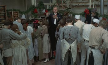 Movie still from “Johnny Got His Gun” (1971), directed by Dalton Trumbo – A group of people standing around a room; Wide shot, High angle