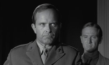 Movie still from “Johnny Got His Gun” (1971), directed by Dalton Trumbo – A black and white photo of a man in a military uniform; Close Up shot, Over the shoulder angle