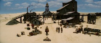 Movie still from “Jonah Hex” (2010), directed by Jimmy Hayward – An image of an old western town scene; Extreme Wide shot, High angle