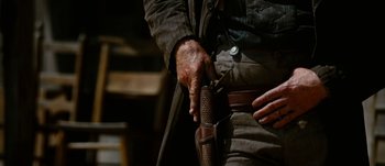 Movie still from “Jonah Hex” (2010), directed by Jimmy Hayward – A man's hand holding a holster; Close Up shot, Low angle