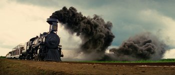 Movie still from “Jonah Hex” (2010), directed by Jimmy Hayward – An old steam engine blowing up a black cloud of smoke; Extreme Wide shot, Low angle