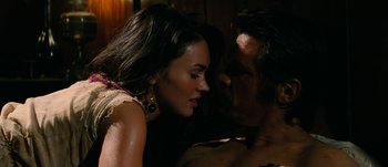 Movie still from “Jonah Hex” (2010), directed by Jimmy Hayward – A man and a woman laying on a bed; Close Up shot, Over the shoulder angle