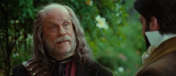 Movie still from “Jonah Hex” (2010), directed by Jimmy Hayward – An old man with long hair and a beard; Close Up shot, Over the shoulder angle