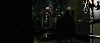 Movie still from “Jonah Hex” (2010), directed by Jimmy Hayward – A group of people standing in a hallway with their feet on the ground; Extreme Wide shot, High angle