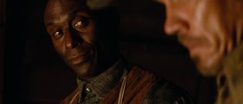 Movie still from “Jonah Hex” (2010), directed by Jimmy Hayward – A man's face in the dark; Close Up shot, Over the shoulder angle