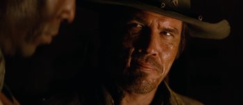 Movie still from “Jonah Hex” (2010), directed by Jimmy Hayward – A person wearing a hat; Close Up shot, Over the shoulder angle