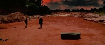 Movie still from “Jonah Hex” (2010), directed by Jimmy Hayward – A person standing in a field with a sky in the background; Extreme Wide shot, High angle