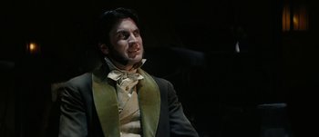 Movie still from “Jonah Hex” (2010), directed by Jimmy Hayward – A man in a suit with a zombie face; Close Up shot, Low angle