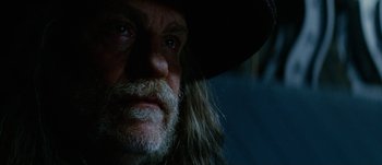 Movie still from “Jonah Hex” (2010), directed by Jimmy Hayward – A person with a beard and a hat; Close Up shot, Low angle