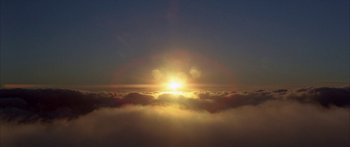 Movie still from “Jonathan Livingston Seagull” (1973), directed by Hall Bartlett – The sun is setting in the middle of the sky; Extreme Wide shot, Low angle