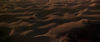 Movie still from “Jonathan Livingston Seagull” (1973), directed by Hall Bartlett – A view from above of sand dunes in the desert; Extreme Wide shot, High angle