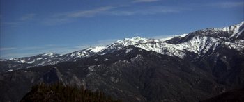 Movie still from “Jonathan Livingston Seagull” (1973), directed by Hall Bartlett – A view of a mountain range with snow on it; Extreme Wide shot, Low angle