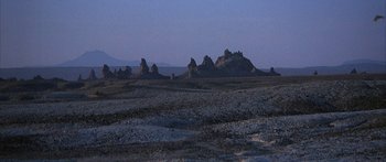 Movie still from “Jonathan Livingston Seagull” (1973), directed by Hall Bartlett – A view of a desert landscape at dusk; Extreme Wide shot, High angle