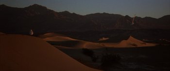 Movie still from “Jonathan Livingston Seagull” (1973), directed by Hall Bartlett – A view of some sand dunes in the desert at night; Extreme Wide shot, Low angle