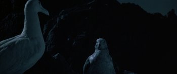 Movie still from “Jonathan Livingston Seagull” (1973), directed by Hall Bartlett – An image of a statue in the middle of the night; Extreme Close Up shot, Low angle