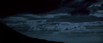 Movie still from “Jonathan Livingston Seagull” (1973), directed by Hall Bartlett – A view of the sky at night from a hill; Extreme Wide shot, Low angle