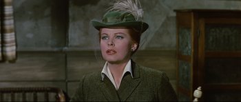 Movie still from “Journey to the Center of the Earth” (1959), directed by Henry Levin – A person wearing a suit and a hat; Close Up shot, Low angle