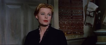 Movie still from “Journey to the Center of the Earth” (1959), directed by Henry Levin – A woman with blue eyes wearing a black jacket; Close Up shot, Low angle