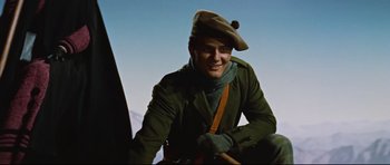 Movie still from “Journey to the Center of the Earth” (1959), directed by Henry Levin – A man wearing a green jacket and a hat; Medium shot, Low angle