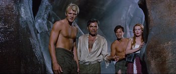 Movie still from “Journey to the Center of the Earth” (1959), directed by Henry Levin – A group of men standing next to each other; Medium shot, Low angle