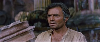 Movie still from “Journey to the Center of the Earth” (1959), directed by Henry Levin – A person wearing a shirt; Close Up shot, Low angle