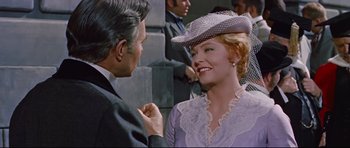 Movie still from “Journey to the Center of the Earth” (1959), directed by Henry Levin – A man and a woman wearing a hat; Medium shot, Over the shoulder angle