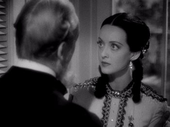 Movie still from “Juarez” (1939), directed by William Dieterle – An old photo of a man and a woman looking at each other; Close Up shot, Over the shoulder angle