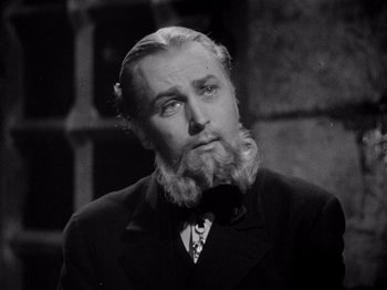 Movie still from “Juarez” (1939), directed by William Dieterle – An older man with a beard and a mustache; Close Up shot, Low angle