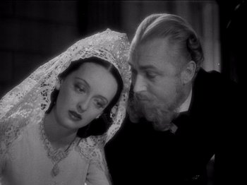 Movie still from “Juarez” (1939), directed by William Dieterle – A man and a woman are looking at one another; Close Up shot, High angle