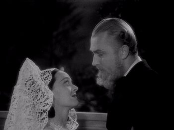 Movie still from “Juarez” (1939), directed by William Dieterle – An old photo of a man and a woman looking at each other; Close Up shot, Low angle